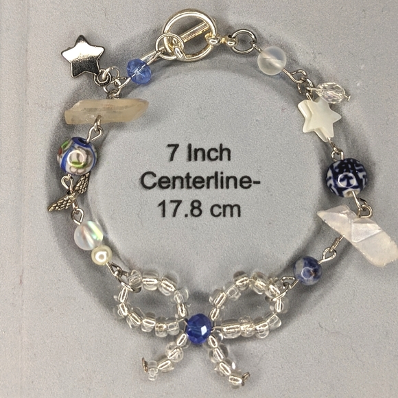 Bracelet with wire beaded bow and blue colored beads. Handmade by me. - Picture 3 of 4